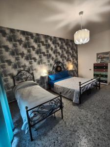 Ένα ή περισσότερα κρεβάτια σε δωμάτιο στο Attico Stadio