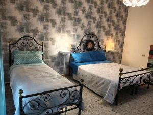 Ένα ή περισσότερα κρεβάτια σε δωμάτιο στο Attico Stadio