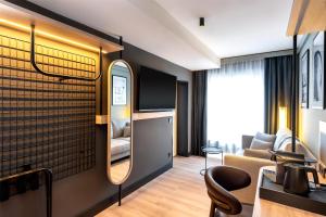 a salon room with a mirror and a chair at Radisson Hotel Düsseldorf City Center in Düsseldorf +35 photos