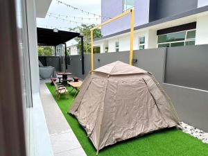 a tent on the side of a building at Desaru 918 Muji Villa in Bandar Penawar