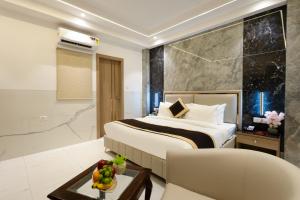 Ένα ή περισσότερα κρεβάτια σε δωμάτιο στο Dahabi Era Delhi Airport - 9 min fr Airport