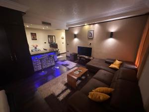 a living room with a couch and a fireplace at Hotel apartment in Monte Cairo Mokattam d202a in Cairo