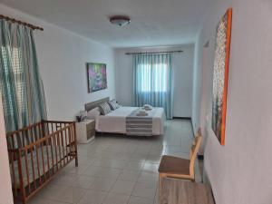 a large bedroom with a bed and a staircase at Villa familiar con piscina privada en Calan Blanes in Cala en Blanes +28 photos