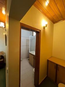 a bathroom with a sink and a toilet in a room at 2 bedroom Villa in Bhurban in Bhurban
