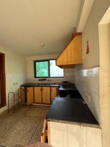 a kitchen with a sink and a counter top at 2 bedroom Villa in Bhurban in Bhurban