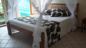 Postel nebo postele na pokoji v ubytování Casa da Arvore Apartamentos Pousada + 49 fotografií