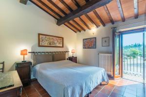 Ένα ή περισσότερα κρεβάτια σε δωμάτιο στο Poggio de' Galli +68 φωτογραφίες