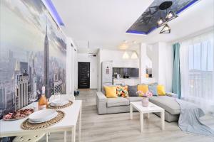 a living room with a couch and tables at Self check in 24h, Simple and Modern, 2 rooms, fast WiFi, parking, air conditioning, free cancelation, Traveller Award in Timişoara