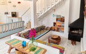 a living room with a couch and a table at Casa Codol in Illes Balears