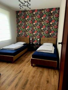 Ένα ή περισσότερα κρεβάτια σε δωμάτιο στο Apartamenty Brama Bieszczad