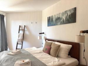 Postel nebo postele na pokoji v ubytování Zu Fuß zu Lift und Loipe mit Saunabereich und Traumblick + 28 fotografií