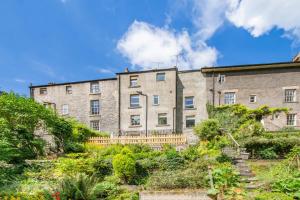 an apartment building in the middle of a garden at 4 Bed in Matlock Bath oc-r32432 in Matlock Bank