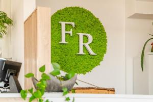 a sign on a wall that says fred at Family Resort Sarbinowo in Sarbinowo +55 photos
