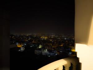 a view of a city lit up at night at The Marrakesh Suites - Skyline ApartHotel In Bahria Town in Rawalpindi