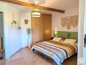 a bedroom with a bed in a room at La maison millesime in La Caunette +94 photos