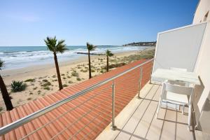 a balcony with a desk and a view of the beach at Ristorante Hotel DA VITTORIO in Menfi