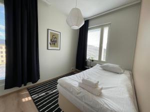 Postel nebo postele na pokoji v ubytování Kotimaailma Turku Cosy 3BR apartment for 5 + 2 fotografie