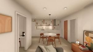 a living room with a table and chairs and a kitchen at CAN MATT Coliving and Residence in Tarragona +6 photos