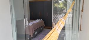 a bedroom with a bed on a balcony at Villas dos Pássaros in Porto Seguro
