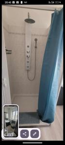 a picture of a shower in a bathroom at Maison 2 chambres doubles cour et jardin 