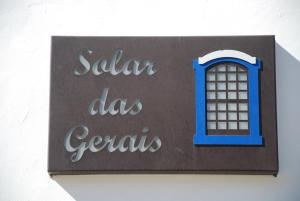 Um certificado, prêmio, placa ou outro documento exibido em Pousada Solar Das Gerais