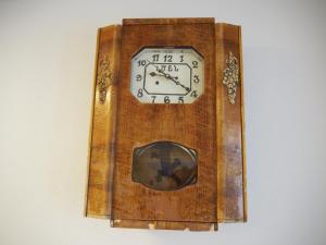 a clock hanging on a wall at NOV Lernatun Boutique Hotel in Ltsen
