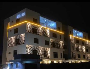 a building with lights on the side of it at Sapphire Suite in Abuja