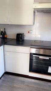 a kitchen with a counter top with a toaster at Home in Colchester in Colchester