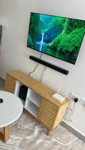 TV a/nebo společenská místnost v ubytování Tusmo homes