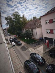 an aerial view of a street with cars parked in front of a building at Apartman Relax in Slavonski Brod