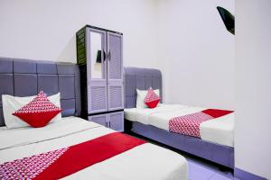 Ένα ή περισσότερα κρεβάτια σε δωμάτιο στο Dancenter Pudan Residence