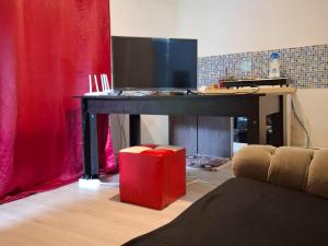 a living room with a table with a television on it at Casa de vacanță cu 4 camere Varlaam in Varlaam