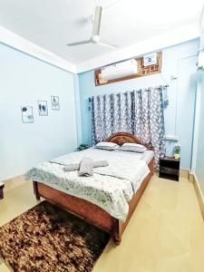 a bedroom with a bed in a room at Jonaki Abax Homestay in Nowgong