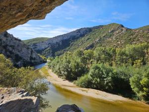 a view of a river in a canyon with mountains at Villa Jolanta in Sevastí