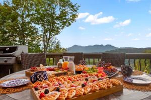 a table with a buffet of fruits and vegetables at 1st in Sugar in Sugar Mountain
