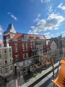 a view from the balcony of an apartment building at Windows to the City Stylish Apartment in Poznań