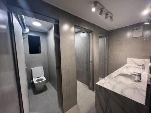 a bathroom with a sink and a toilet at Dahab Hostel in Cairo