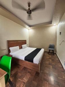 a bedroom with a bed with a ceiling at Kerala Homes Near Nizamuddin in New Delhi