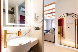 a bathroom with a sink and a mirror at Siesta de La Jefa in Granada +262 photos