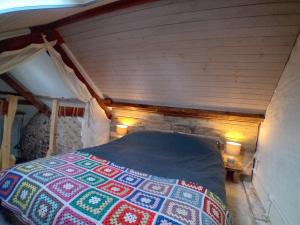 a bedroom with a bed in a small room at The Barn Square Island in Pembroke