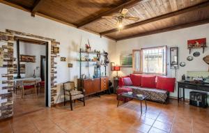 a living room with a couch and a table at Pet Friendly Home In Ragusa With Wifi in Ragusa