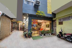 a store with motorcycles parked outside of a building at Double RR - Main Market Paharganj in New Delhi