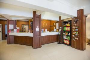 a restaurant with a counter and a grocery store at Chiang Roi 7 Days Inn in Chiang Mai