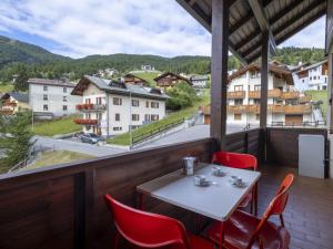 a table and chairs on a balcony with a view at Apartment Oga Mountain Home by Interhome in Oga