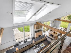 an attic conversion of a house with a skylight at Holiday Home Talitha - 40m from the sea by Interhome in Marielyst