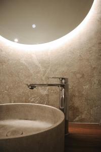 a bathroom with a tub and a circular ceiling at Maison Aimée in Han-sur-Lesse +66 photos