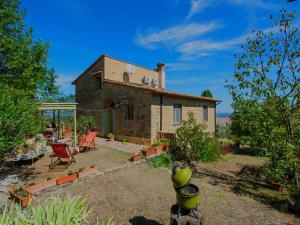 an external view of a house in a garden at Holiday Home Villa Albertine by Interhome in Fattoria Spedaletto