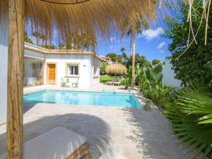 a villa with a swimming pool and a resort at Villa Serenidad by Interhome in Casas de Torrat +37 photos