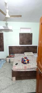 a bedroom with two beds in a room at Rajawat house in Tonk City