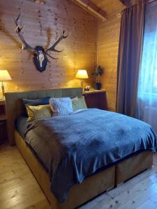 Кровать или кровати в номере Alpenchalet am Golfplatz